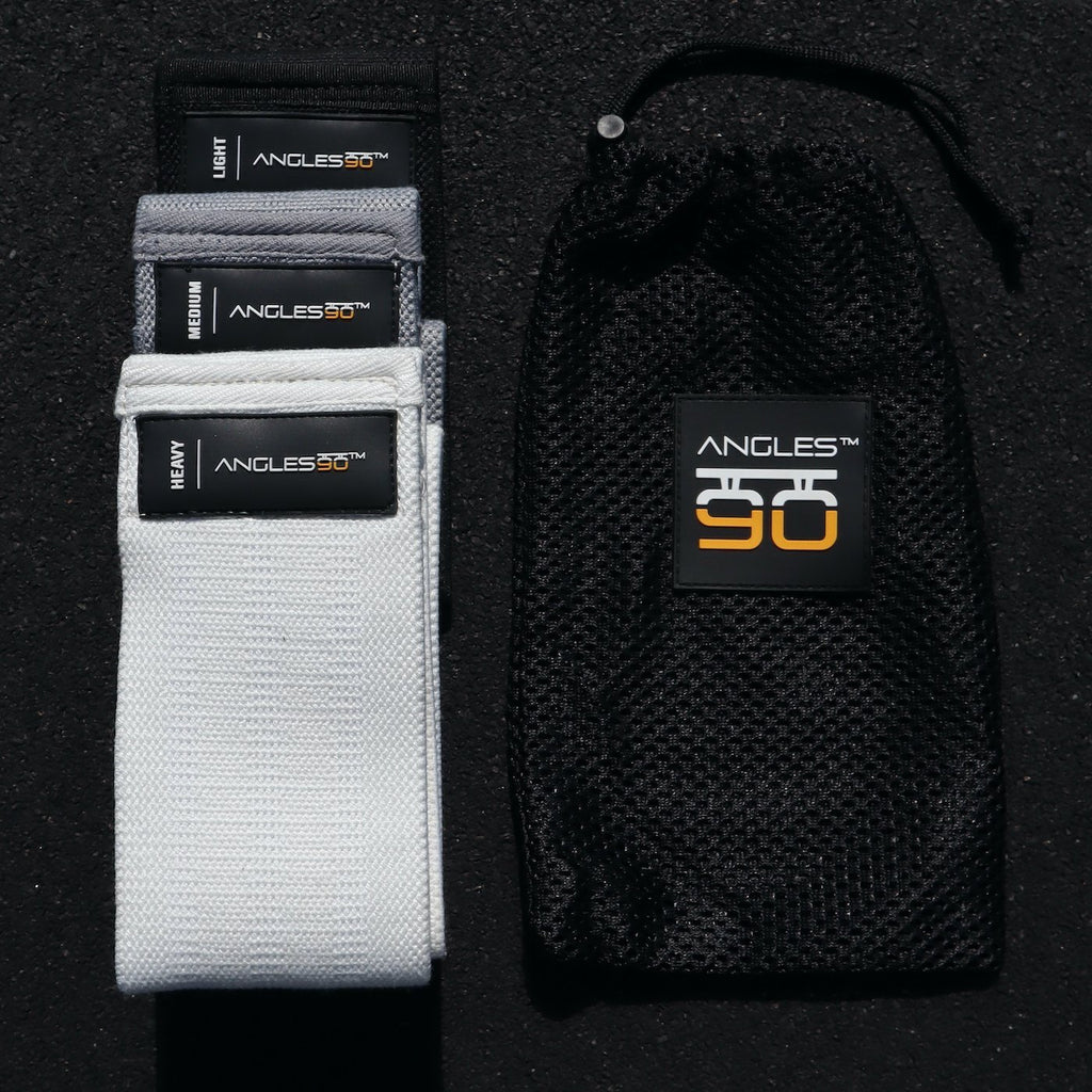 A collection of A90 Leg Day Set branded resistance bands and ankle straps in various sizes displayed alongside a black carrying pouch.